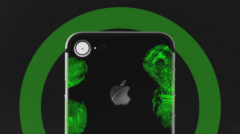 Green thumbprints on the back of an iPhone
