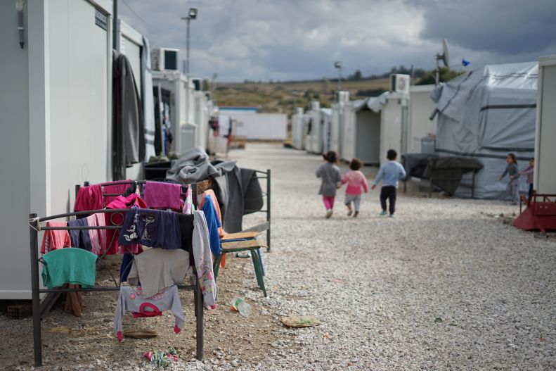 children walking in a refugee camp