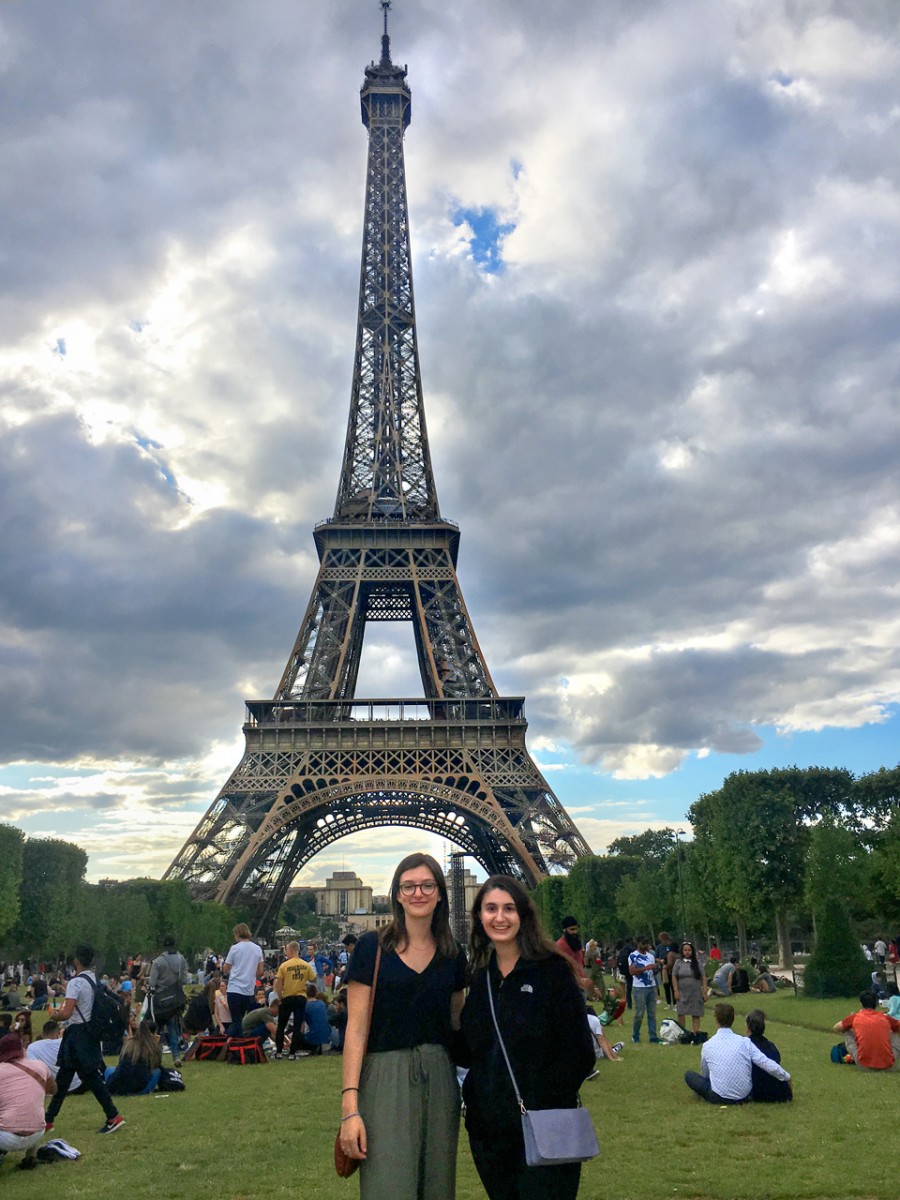 Sophie Partington and Laura DeMassa pose in front of the Eiffel Tower