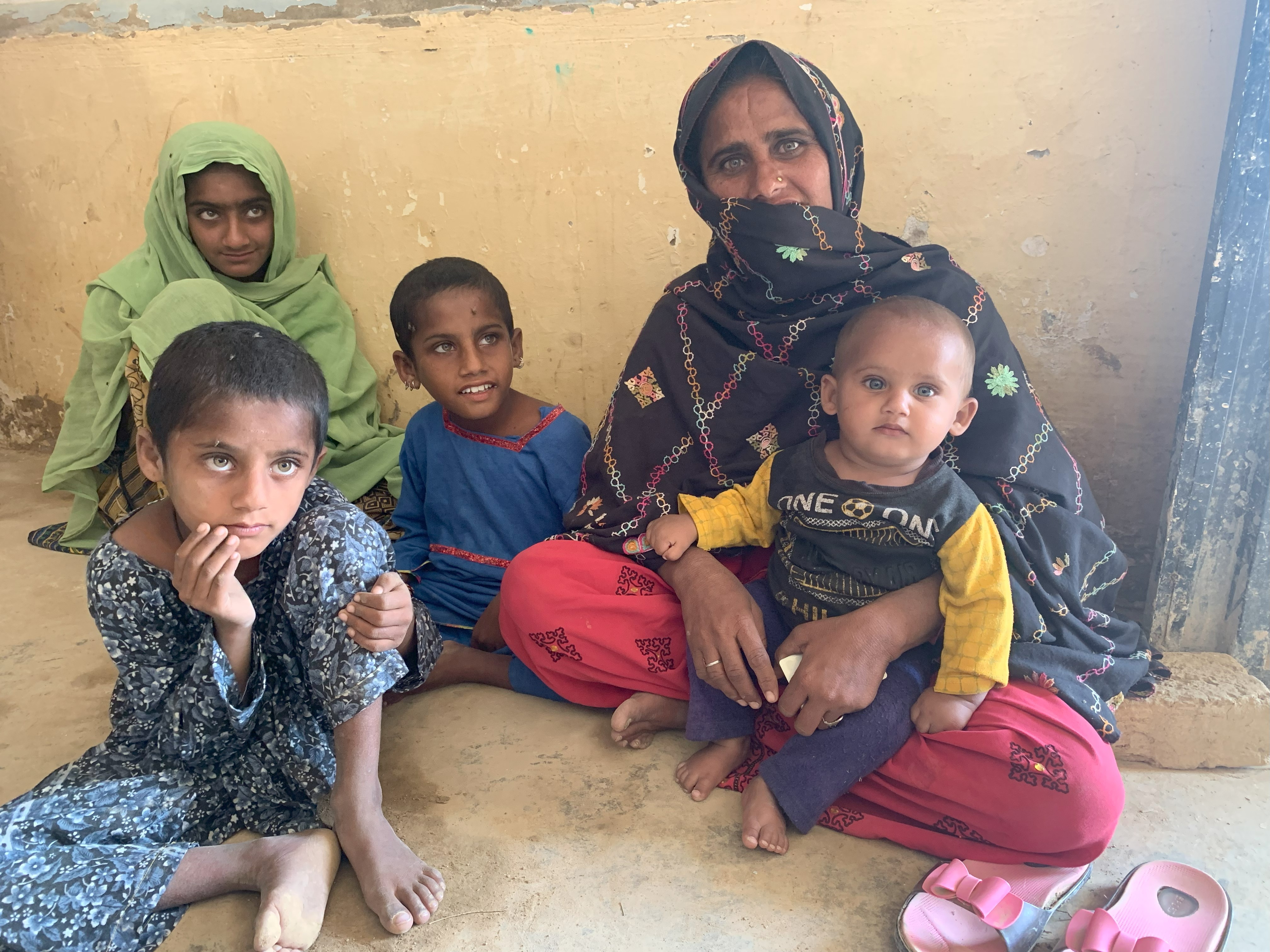 Laila with her children. Location: Balochistan, Pakistan