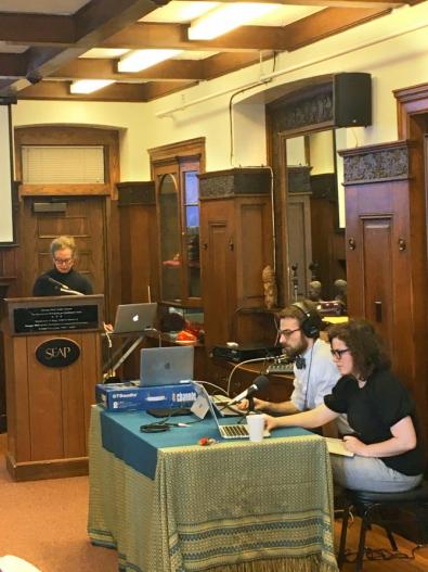 Students sit around computers