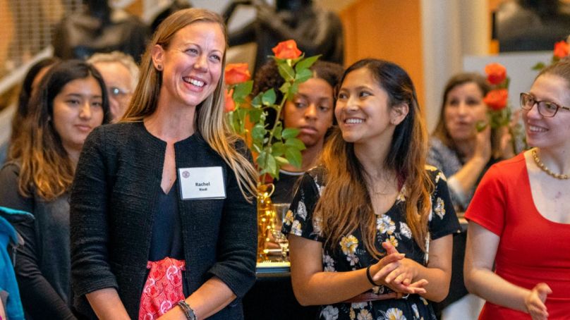 Director Rachel Beatty Reidl with student workers at an Einaudi Center reception