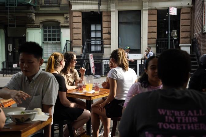 People eating outside at a restaurant