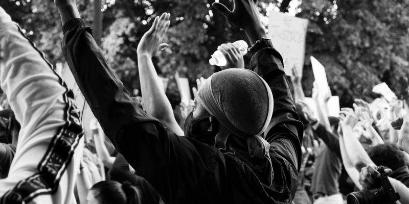 racial justice image of protesters with arms in the air Koshu Kunii photographer
