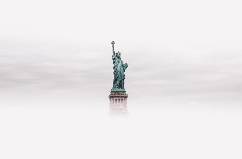 Statue of Liberty emerging from fog