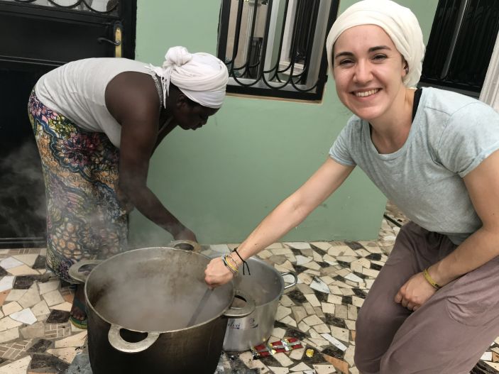 Past IAD intern Elizabeth Heffern ’21 cooking traditional soup with her Gambian host sister.