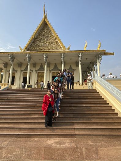 Students posing in front of a Cambodian temple