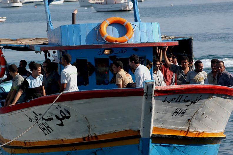 A boat arrives on the Italian island of Lampedusa in 2008. 