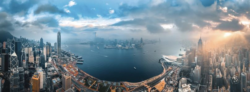 Panorama of Hong Kong with mist, clouds, and mountains during the day