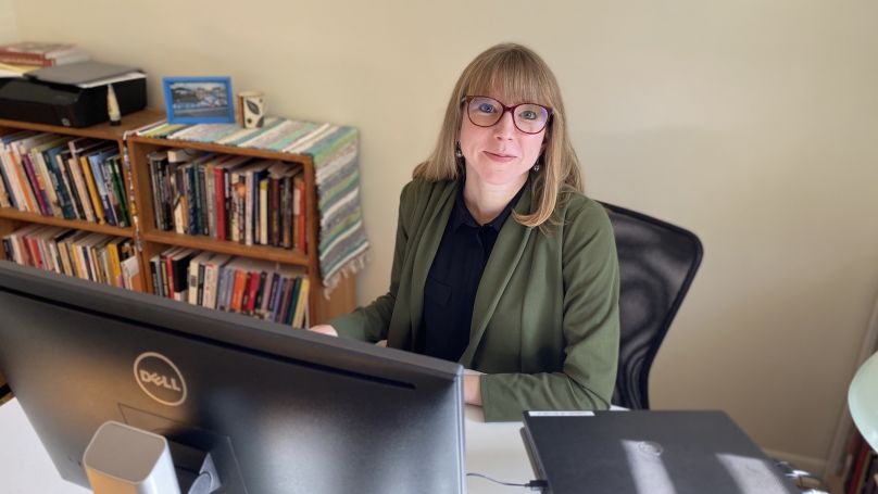 Eleanor Paynter Migrations at desk