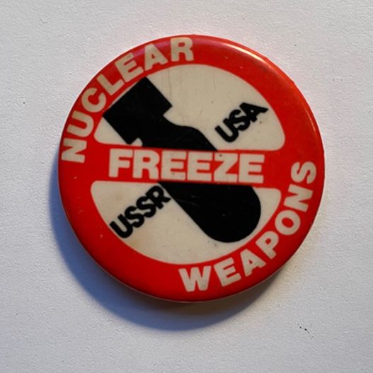 lapel button reads Nuclear Weapons Freeze, directed at USSR and USA