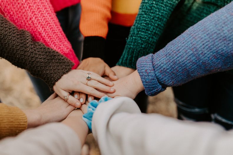 hands clasping team