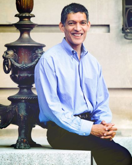 Eswar Prasad 2022 seated outside on campus