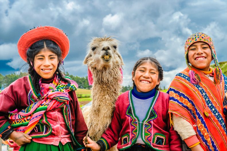 Smiling Quechua Children by Alexander Schimmeck (Unsplash)