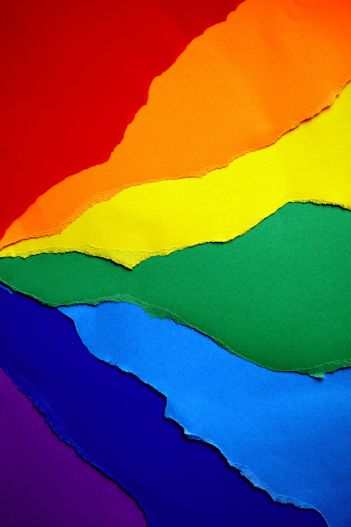 Ripped rainbow-colored paper background