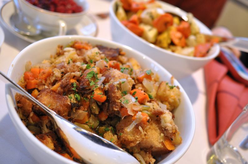 Bowl of stuffing on a Thanksgiving table