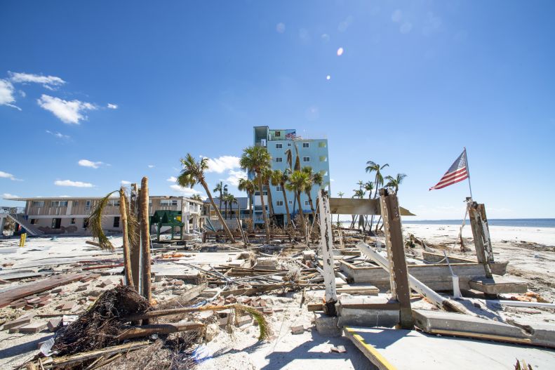 American flag stands in wake of Hurricane Ian at Fort Myers Beach, Florida (on Oct. 2, 2022. (U.S. Air National Guard photo by Senior Airman Jesse Hanson)