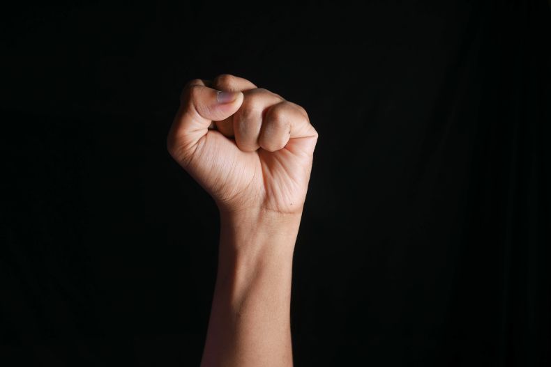 single fist raised in protest 