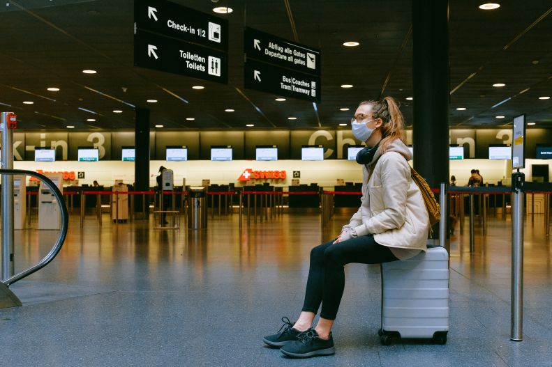 young female traveler in transit at airport