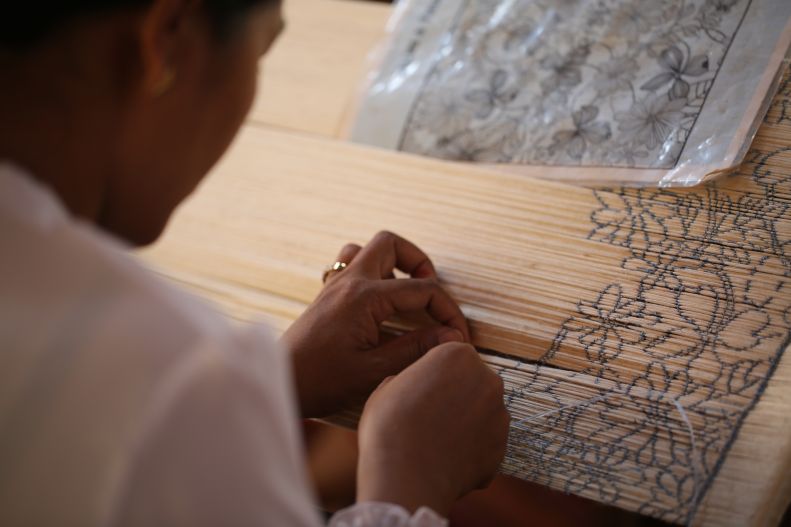 An image of someone weaving