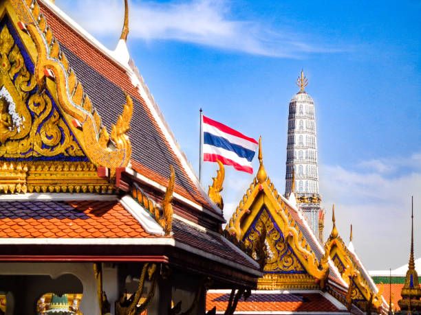 Grand Palace - Thai Temples, Golden Rooftops, and Thai Flag - Bangkok (By Nate Hovee)