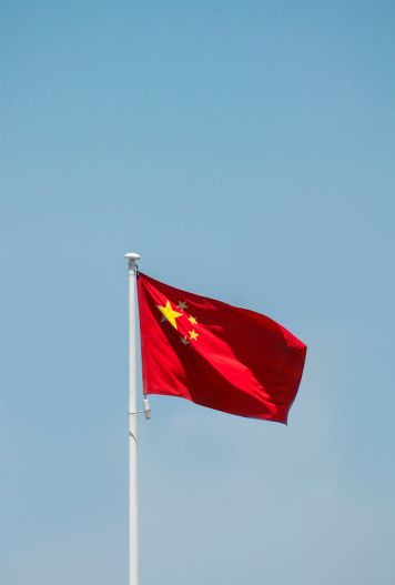 China flag in blue sky