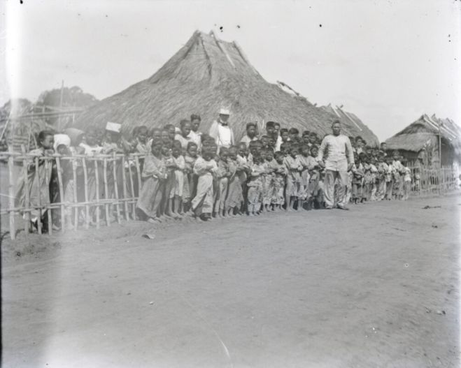 Image of a school in a concentration camp in the Philippines during the American occupation, circa 1900. Adjusted into positive from glass plate negatives of the Gerow D. Brill Papers in Cornell University Library's Rare and Manuscript Collections.