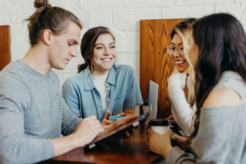 Group of students sitting and smiling