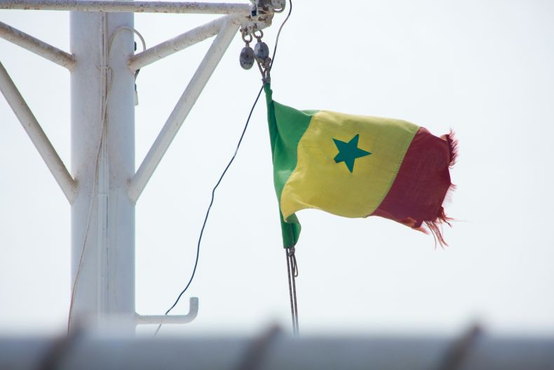 Tattered flag of Senegal flying over Dakar, Sénégal