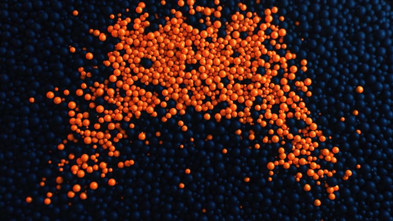 Orange balls on a blue surface