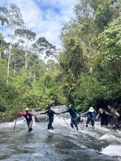Group of Laidlaw scholars crossing river, summer 2025
