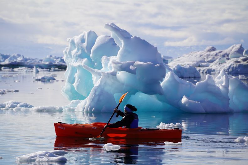 Fulbrighter Kyrin Pollock kayaks among icebergs.