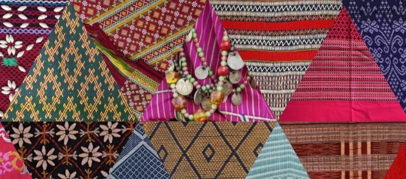 A collage of textile triangles, featuring patterns from Myanmar.