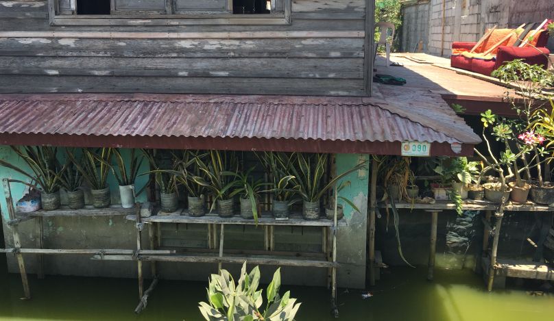 House sits in murky flood waters