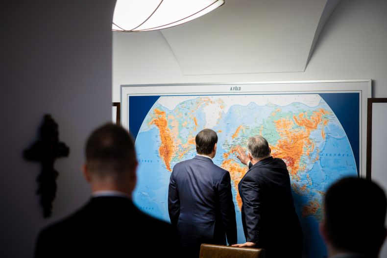 Secretary Marco Rubio meets with Hungarian Prime Minister Viktor Orban in Budapest, Hungary, February 16, 2026. They look at a world map with their backs to the camera.