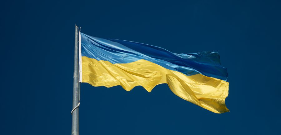 Ukraine flag flying blue sky