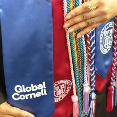 international graduate with Global Cornell stole and cords
