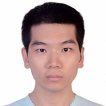 Wenzheng faces camera wearing a white shirt and has short cropped hair