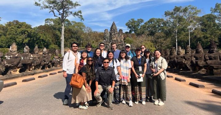 Cambodia winter program 2023 students with archaeology expert Ea Darith at the southern entrance to Angkor.