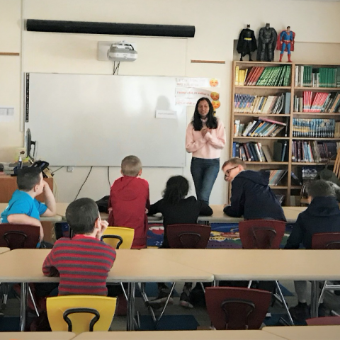 Volunteer teaching an elementary school class