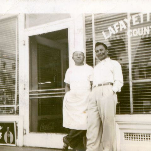 Pablo 'Ambo' Mabalon (left), Dawn Mabalon's grandfather, stands in front of his Lafayette Lunch Counter, which was in the heart of Little Manila. (Courtesy Little Manila Rising)