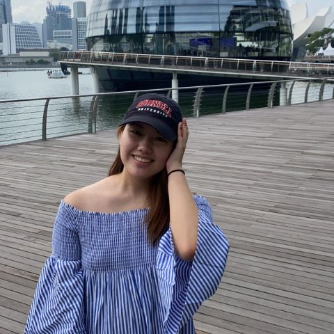 Cornell student in Singapore smiles for a photo.