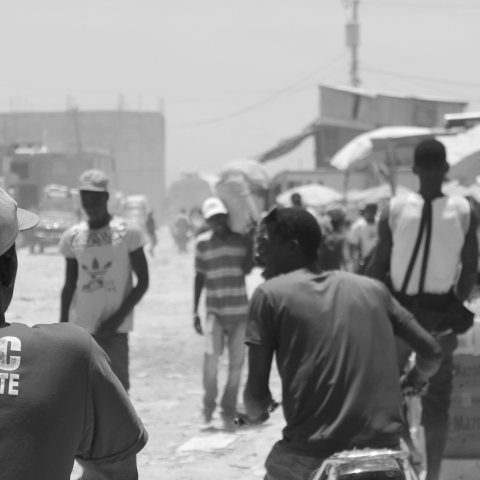 Motorcyclists on the road leading up to the border crossing station between Haiti and the Dominican Republic.