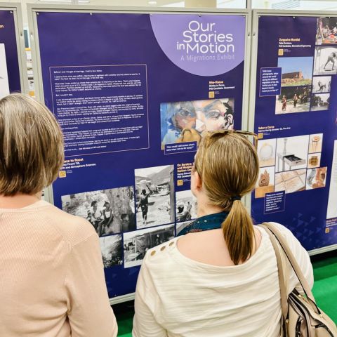 People view the "Our Stories in Motion" exhibit.
